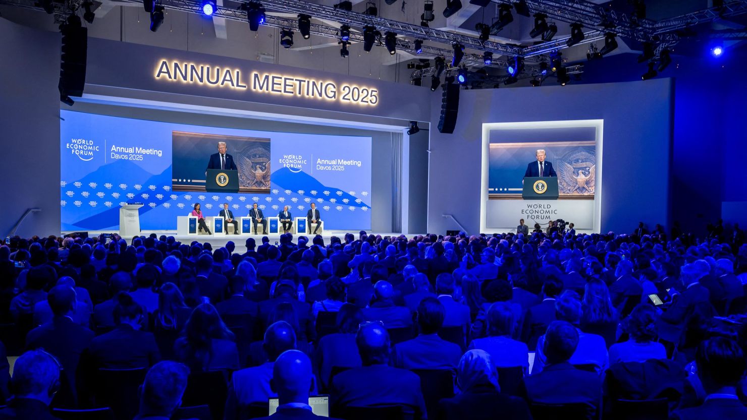 c-gettyimages-2194844693 President Donald Trump is seen on a giant screen during his address by video conference at the World Economic Forum (WEF) annual meeting in Davos on January 23.